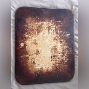 Pampered Chef Stoneware cooking sheet.